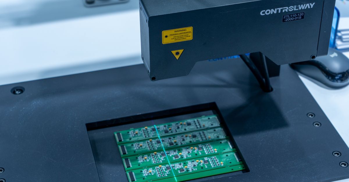 Close-up of a PCB inspection machine in action, highlighting technology.