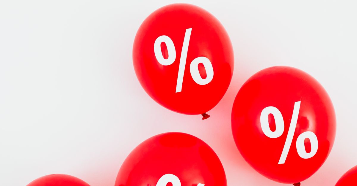 Bright red balloons with percent symbols, ideal for sales promotions and discounts.