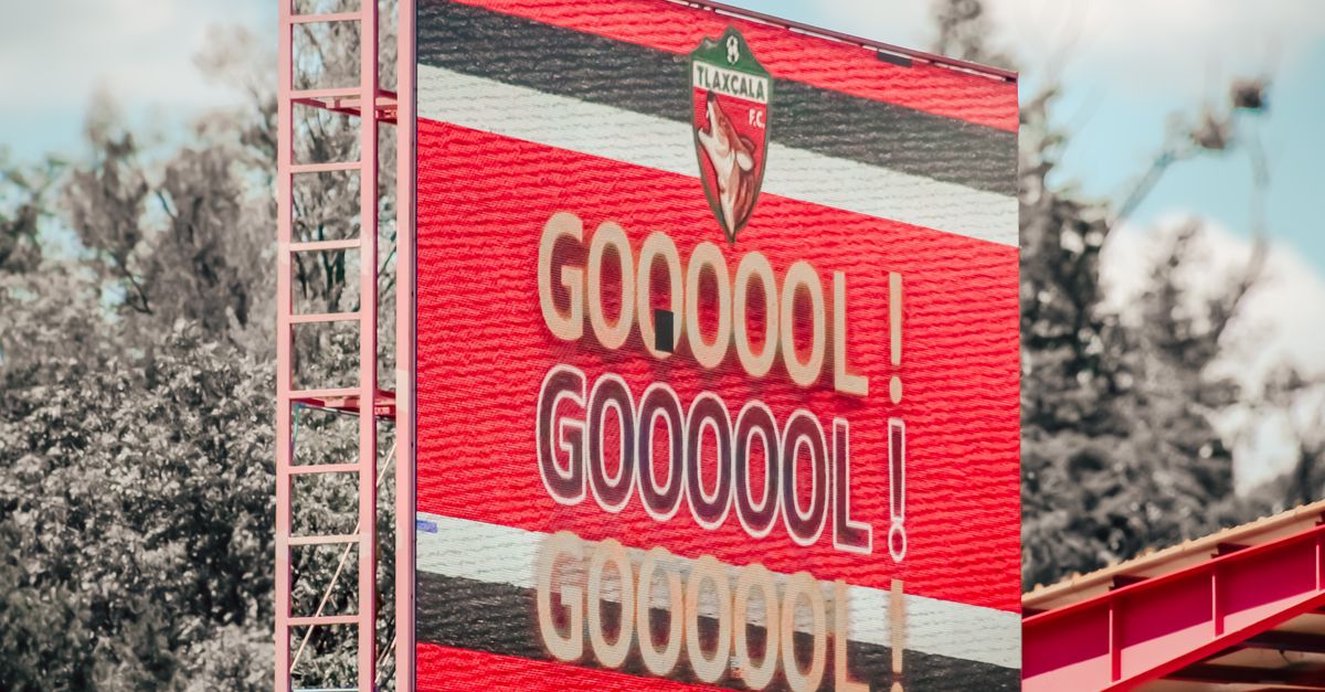 Vibrant display of a goal announcement at a Tlaxcala FC soccer match. Bright and engaging visuals.