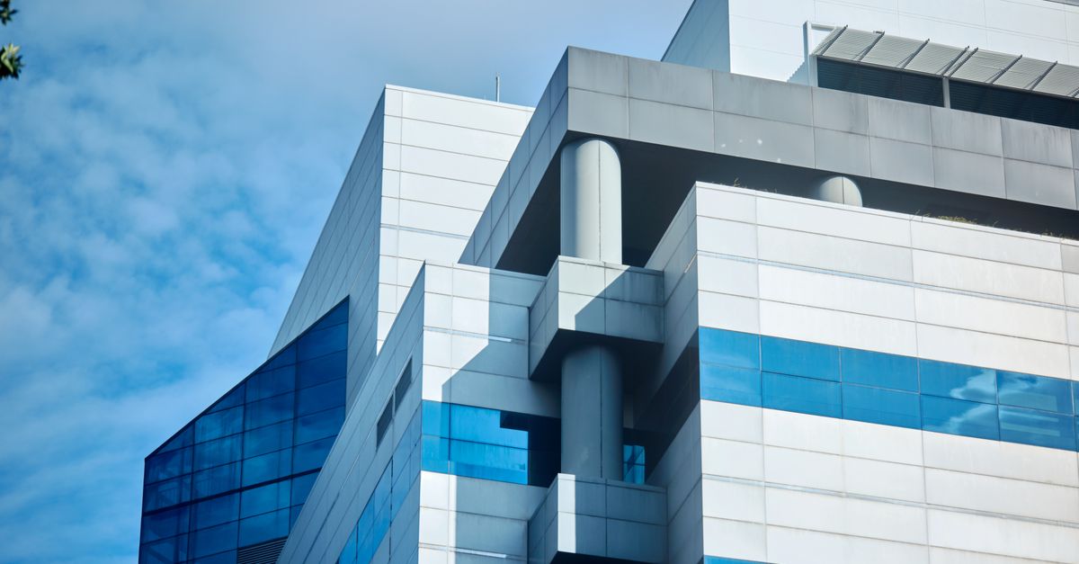 Futuristic architecture of a sleek office building in Singapore.