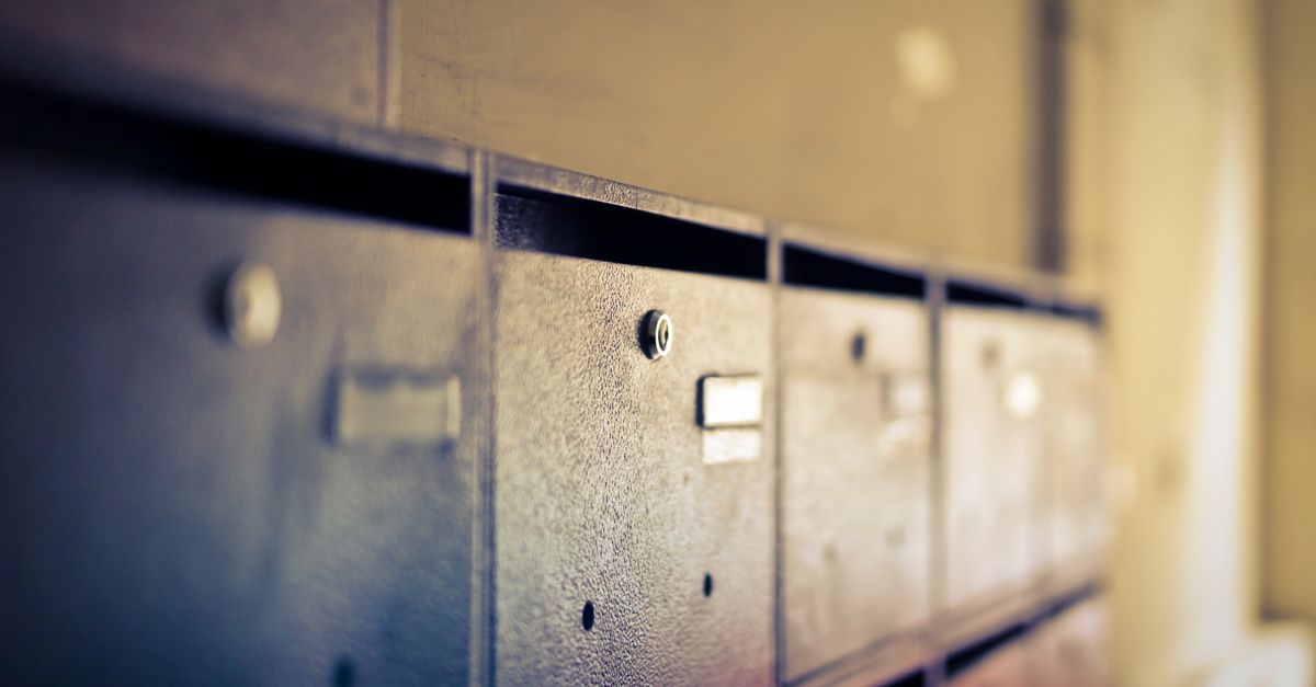 A close-up shot of vintage metal mailboxes indoors with a soft blur effect.