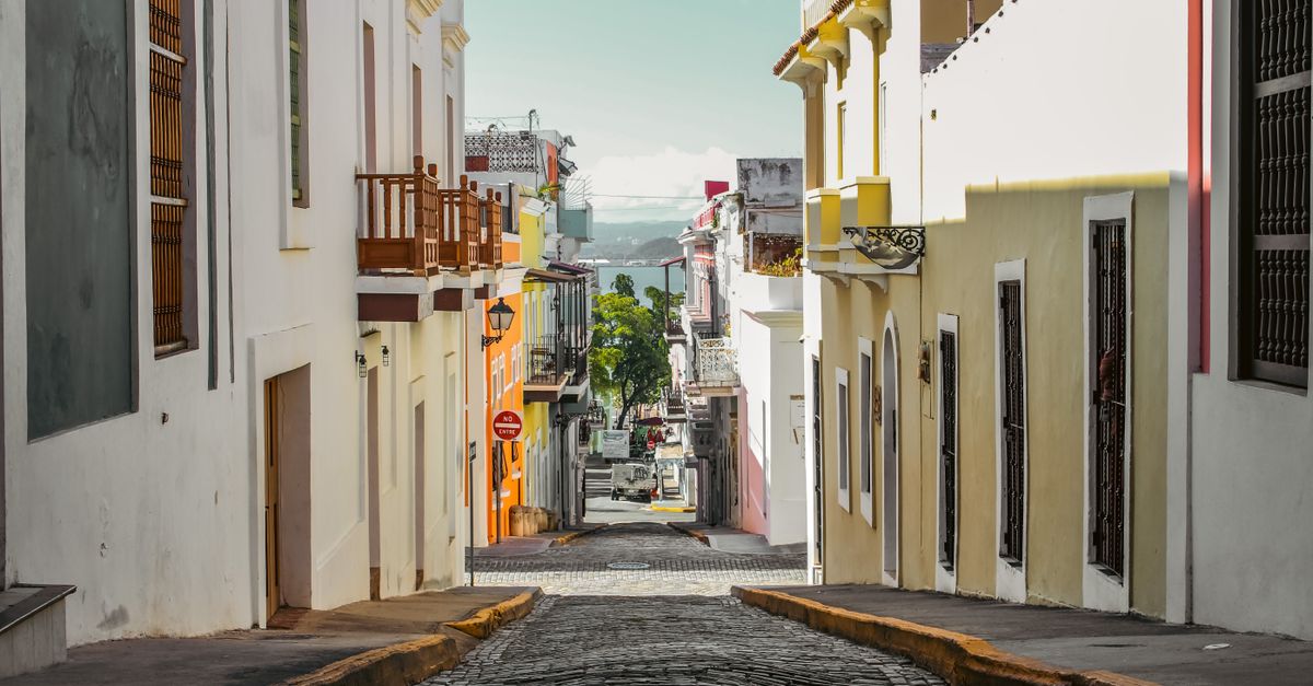 Explore the colorful cobblestone streets of Old San Juan, Puerto Rico, perfect for summertime tourism and travel.