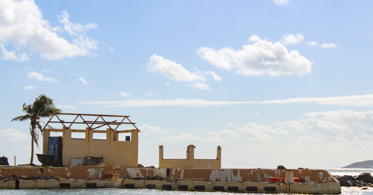Dilapidated waterfront structure in Fajardo, Puerto Rico, post-hurricane.