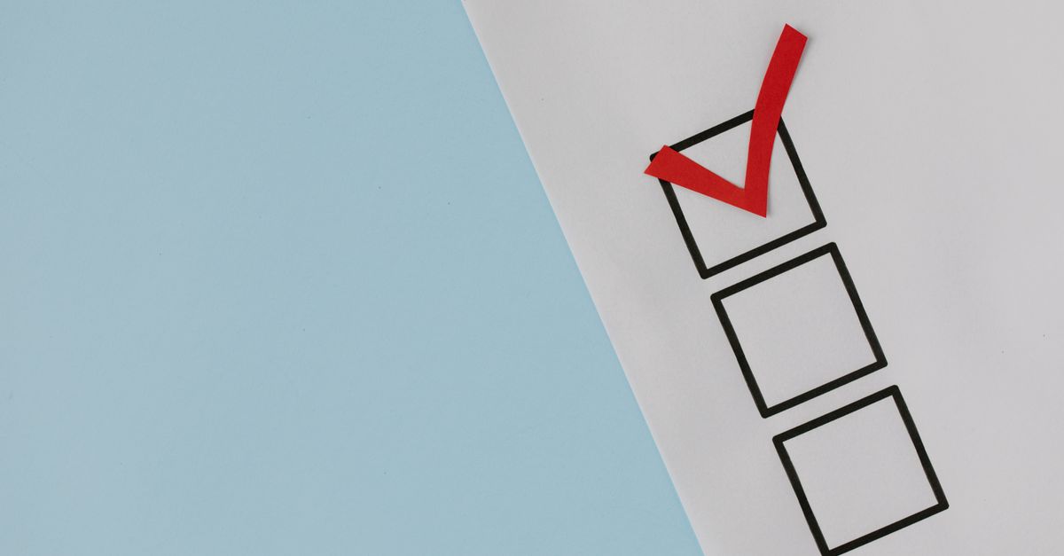 A simple white paper checklist with one red checkmark, ideal for concepts like completion or approval.