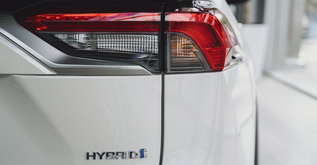 Elegant close-up of a hybrid car tail light showcasing modern automotive design.