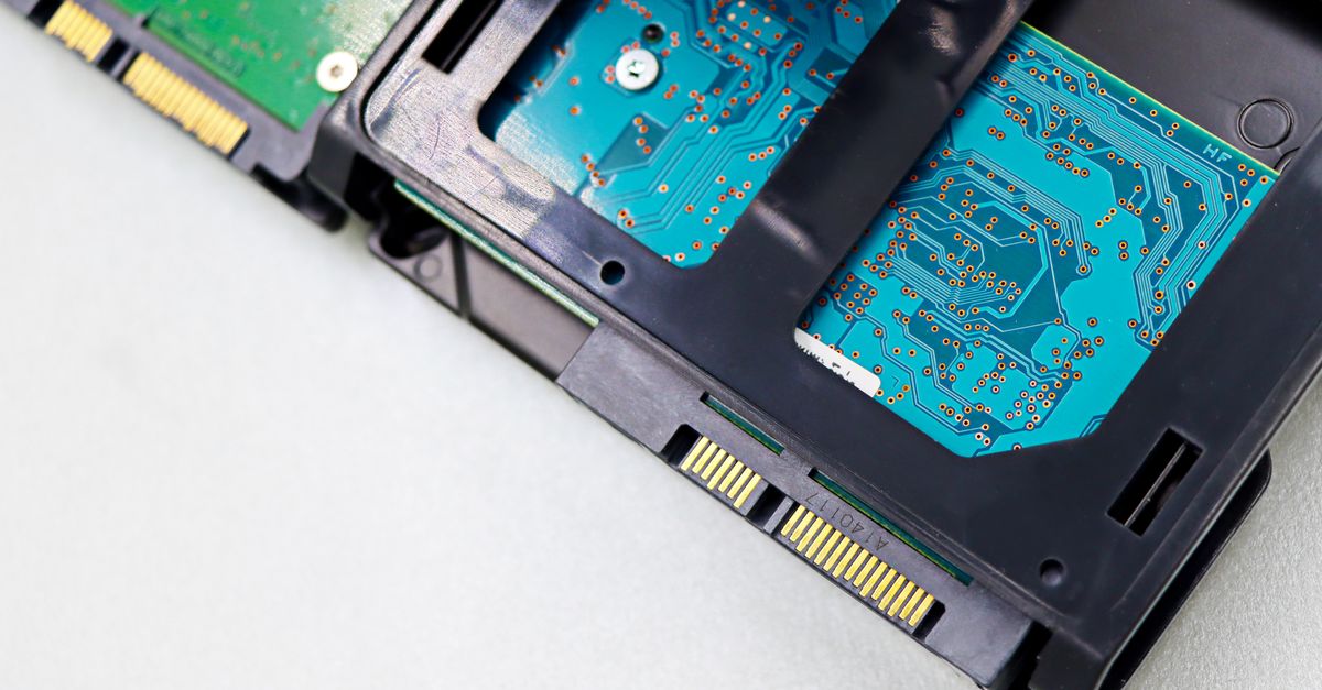 Detailed view of computer hard disk drive components, showcasing circuitry and connectors.