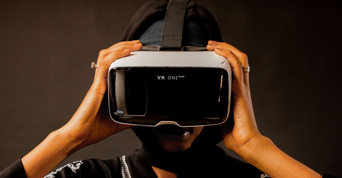 Woman using a VR headset, immersed in a virtual reality experience.