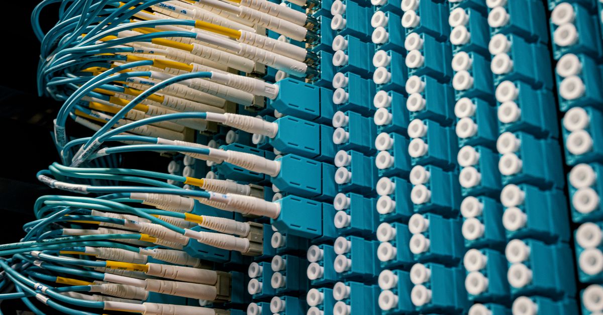 From below of fiber optic equipment with similar colorful rubber cables and round sockets