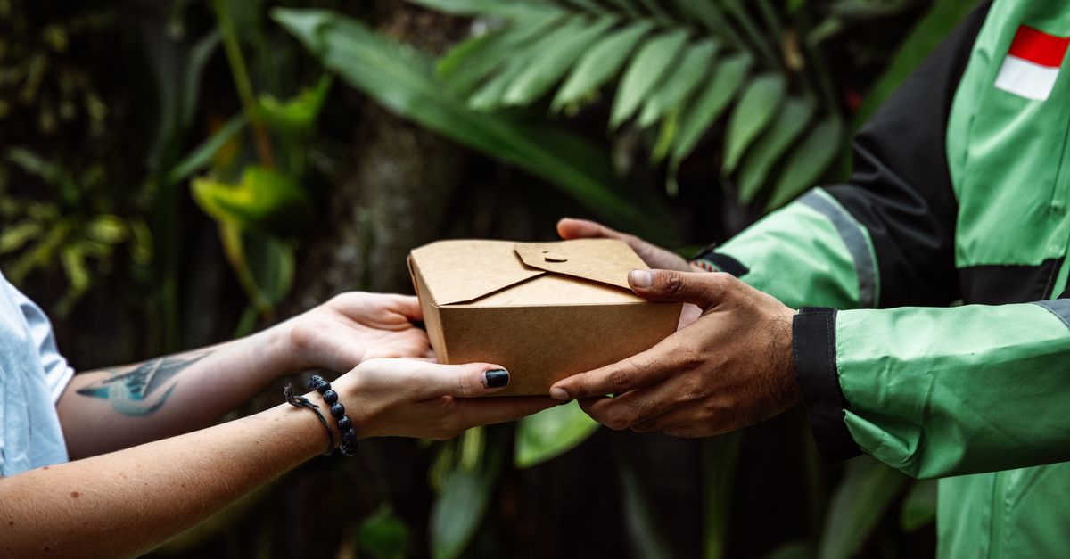 Eco-friendly food delivery service in a natural setting with a package exchange.