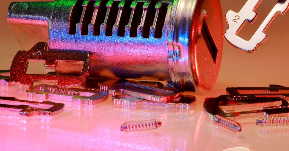 Detailed close-up of metal lock and key parts with colorful reflections, ideal for illustrating technology or security concepts.