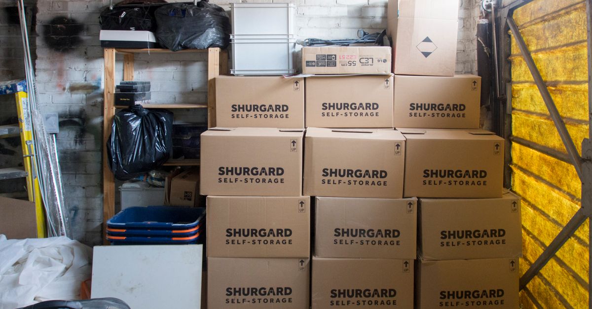 A stack of storage boxes in a well-organized warehouse interior.