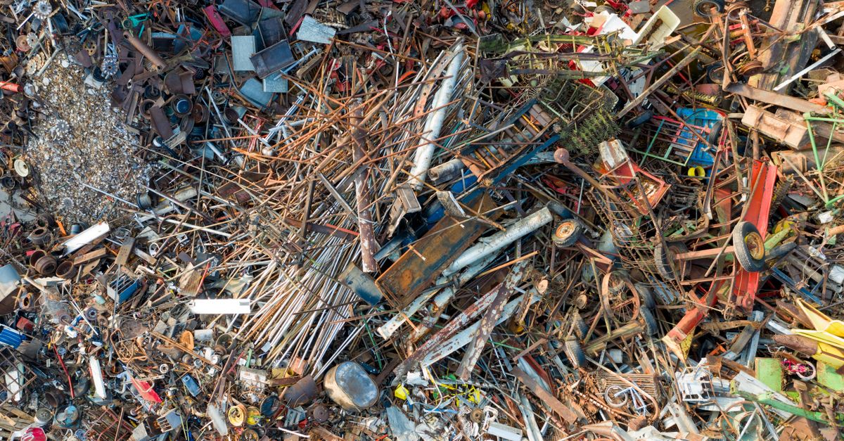Aerial shot of scrap metal and waste gathered in a junkyard for recycling purposes.