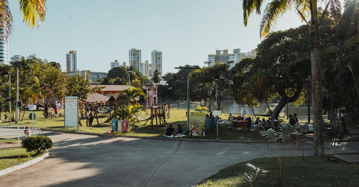 People enjoying leisure time in a sunny park in Natal, Brazil.