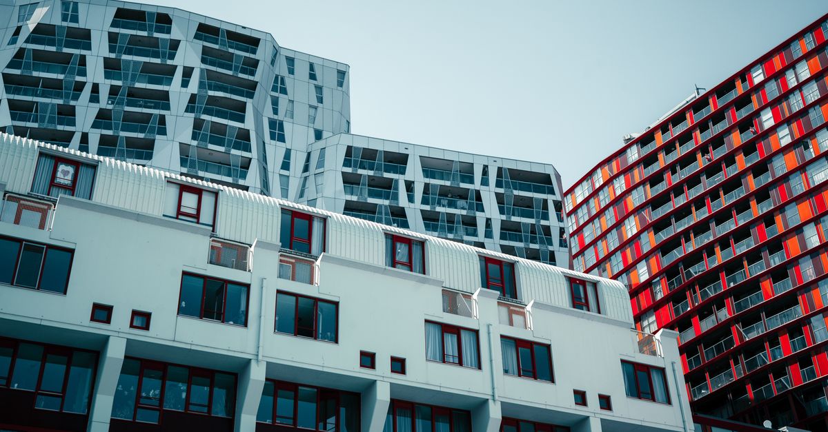 Low angle shot of contemporary urban buildings, highlighting modern architecture.