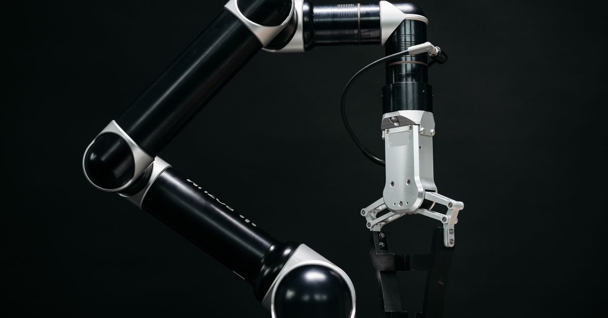 Close-up of a mechanical robotic arm with a dark background, showcasing advanced technology.