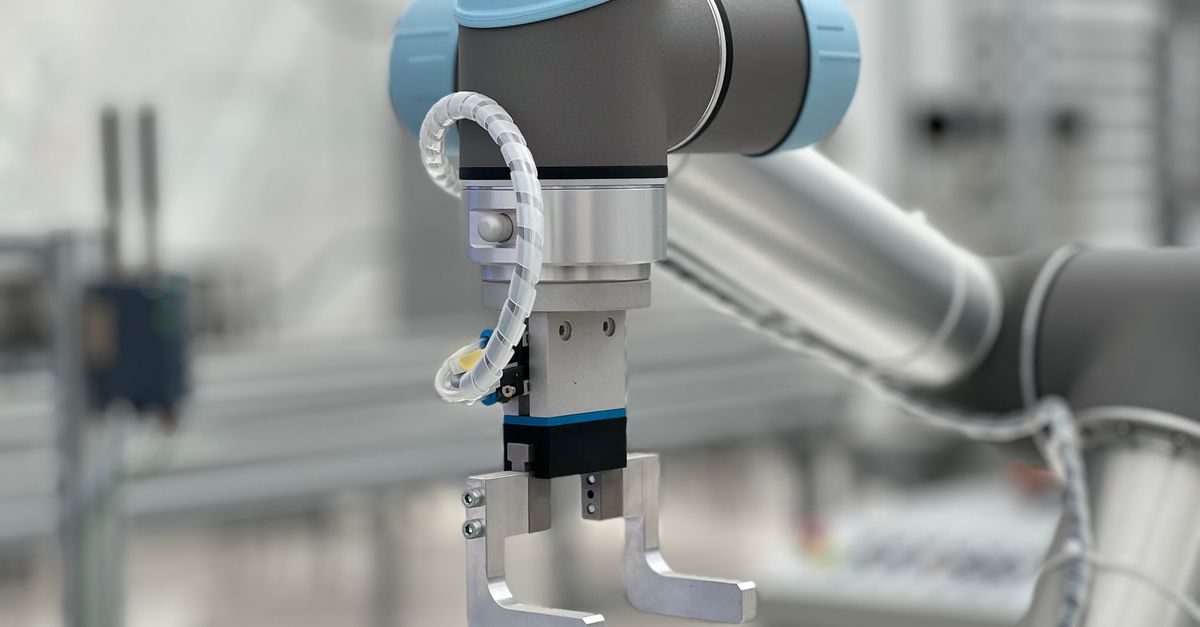 Close-up of a robotic arm in a modern industrial environment, highlighting technology.