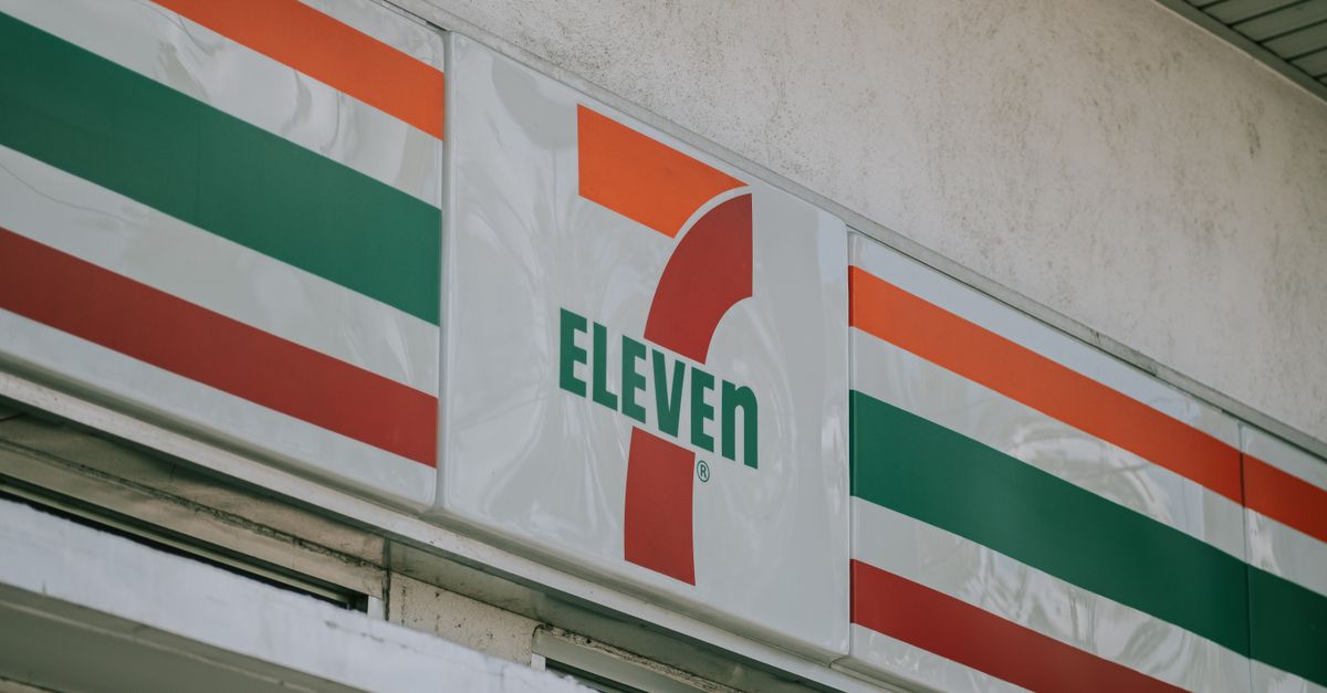 Close-up of a convenience store's iconic sign above the entrance.