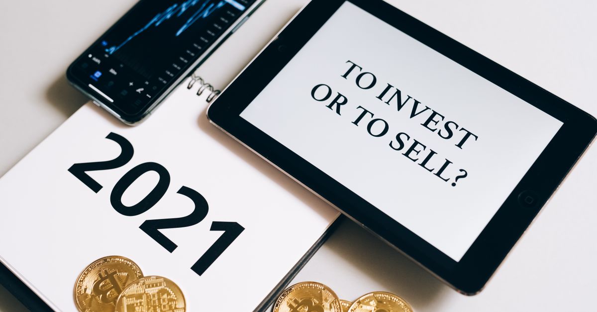 Bitcoin and investment strategy visualized with smartphone, tablet, and coins.