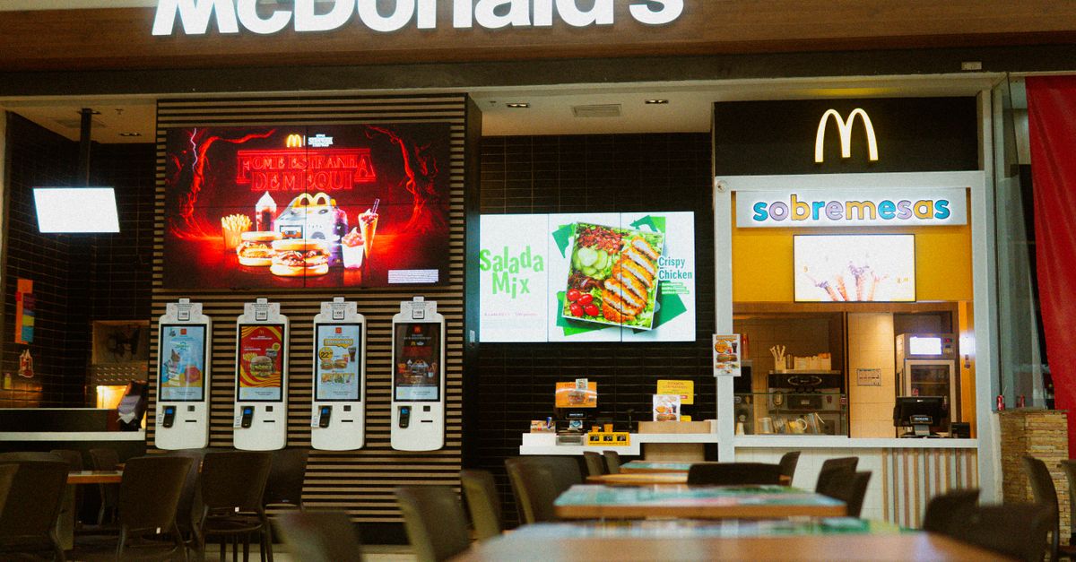 McDonald's fast food restaurant featuring self-service kiosks and digital menus.