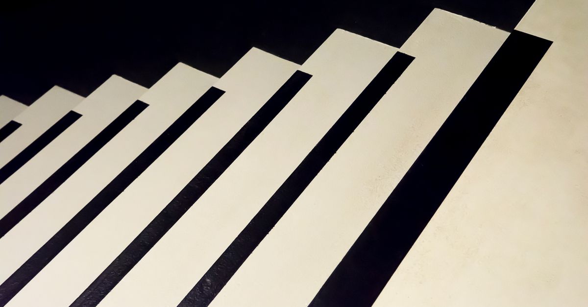 Creative abstract pattern resembling piano keys or stairs in black and white tones.