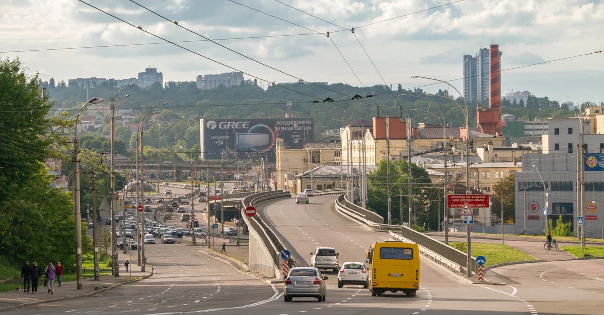View of urban traffic and architecture in downtown Kyiv, featuring roads and skyline.