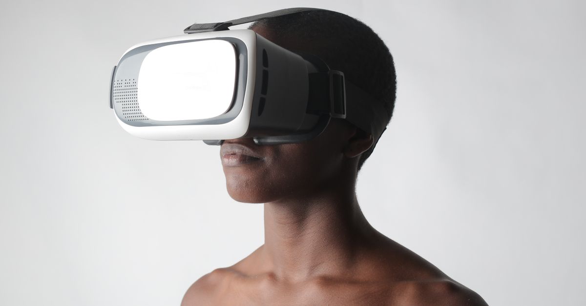 Close-up of a person using VR goggles, showcasing futuristic technology and innovation.