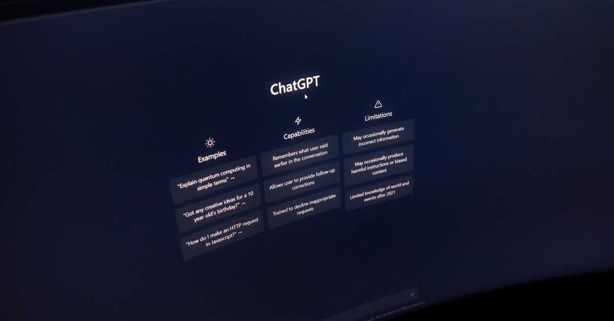 Close-up of a computer screen displaying ChatGPT interface in a dark setting.