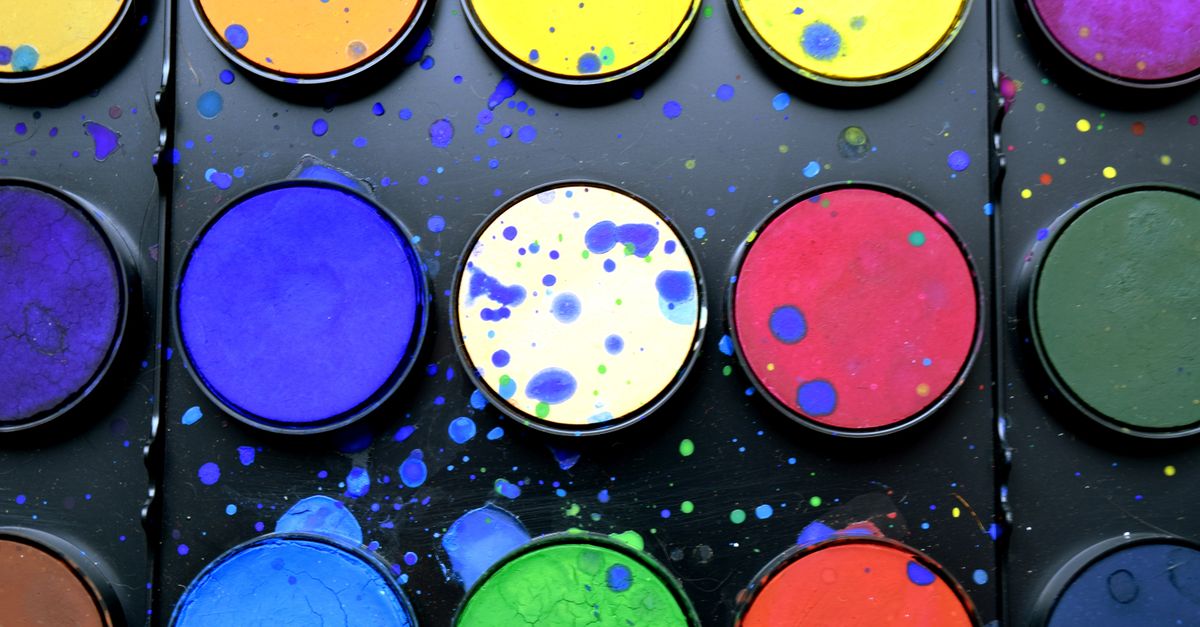 A colorful watercolor paint set showcasing diverse hues and textures.