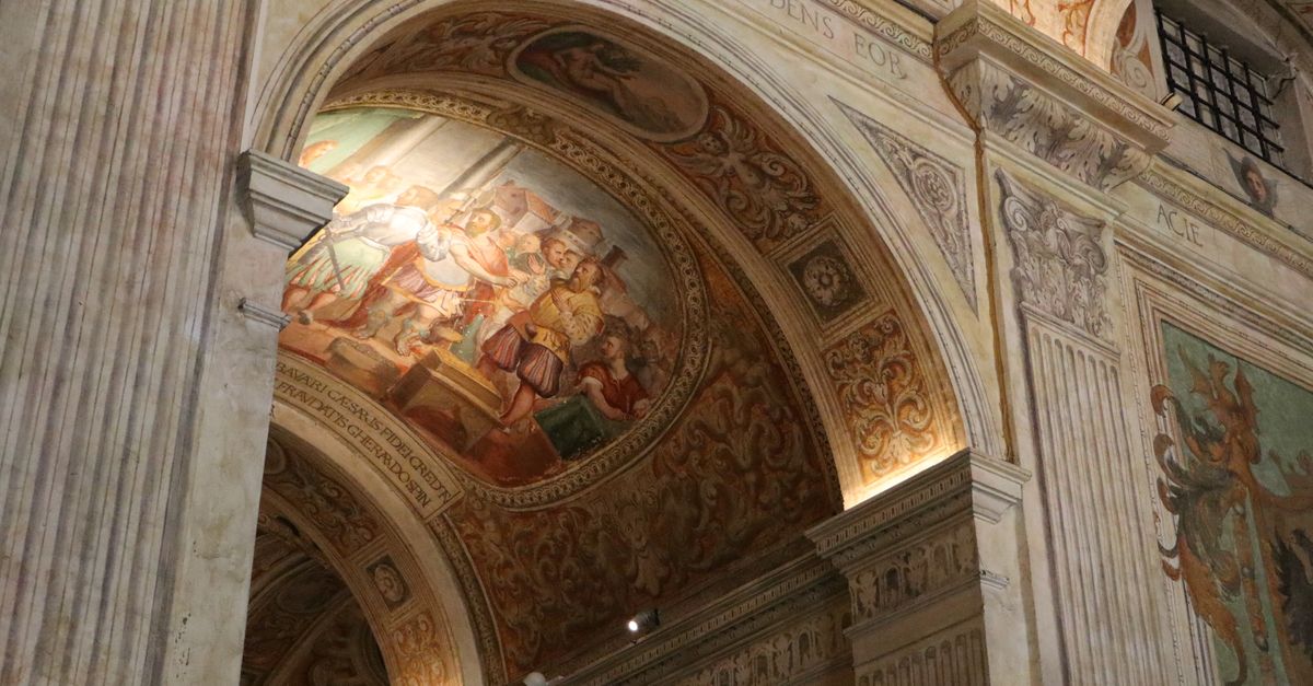 Renaissance fresco with intricate details inside a historical Italian building, showcasing classic artistry.