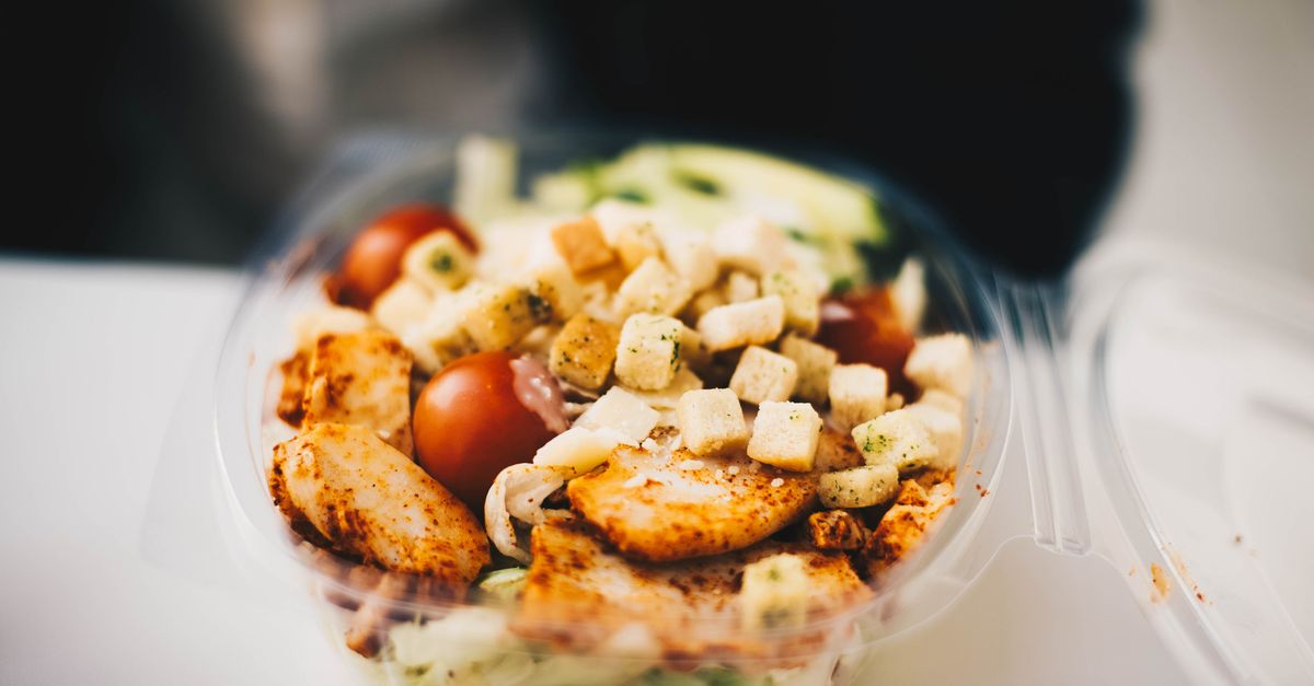 Delicious chicken salad with fresh greens and croutons, perfect for a healthy meal.