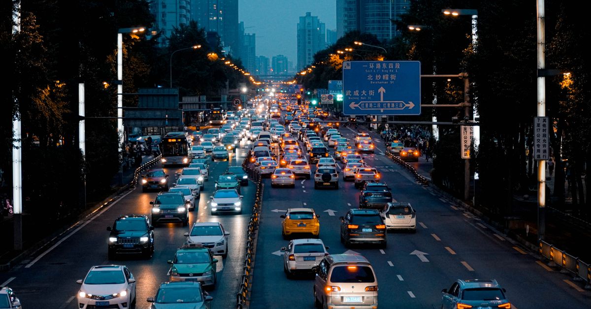Evening traffic in downtown Chengdu showcasing vibrant urban life in Sichuan, China.