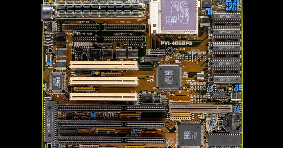 Detailed close-up of a vintage motherboard showcasing electronic circuits and components.