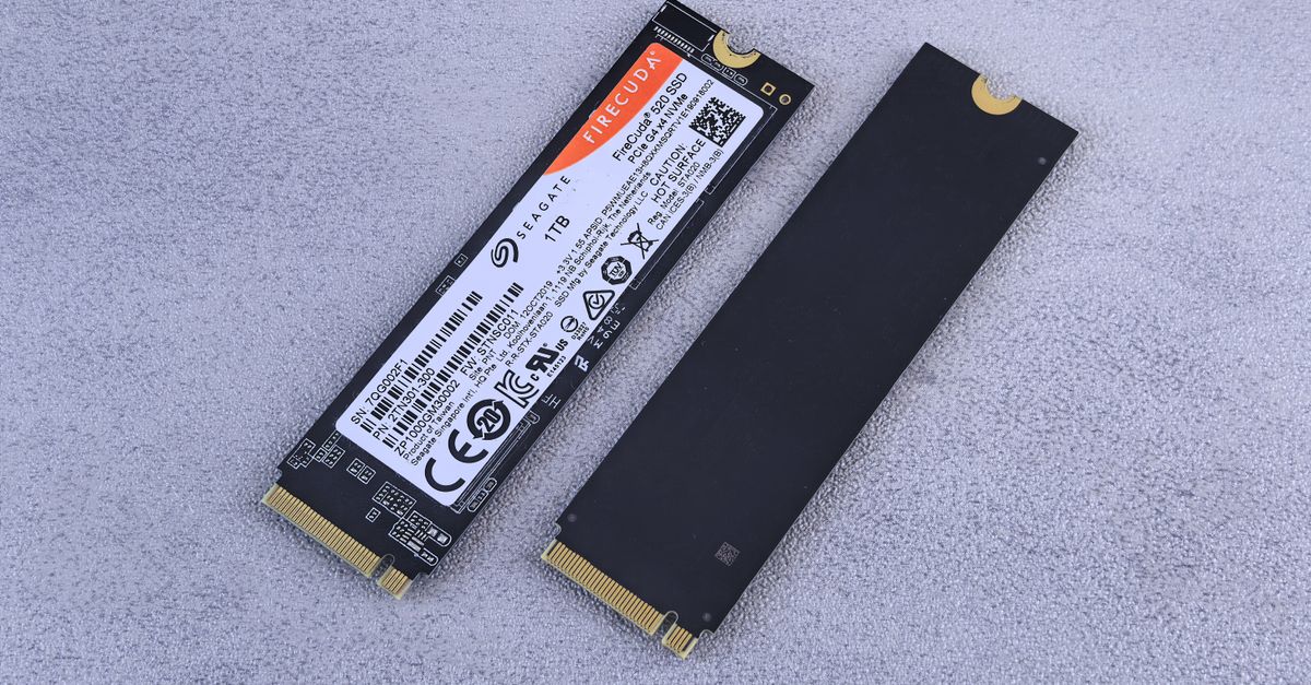 Two NVMe SSDs, Seagate FireCuda, on a gray background for tech enthusiasts.