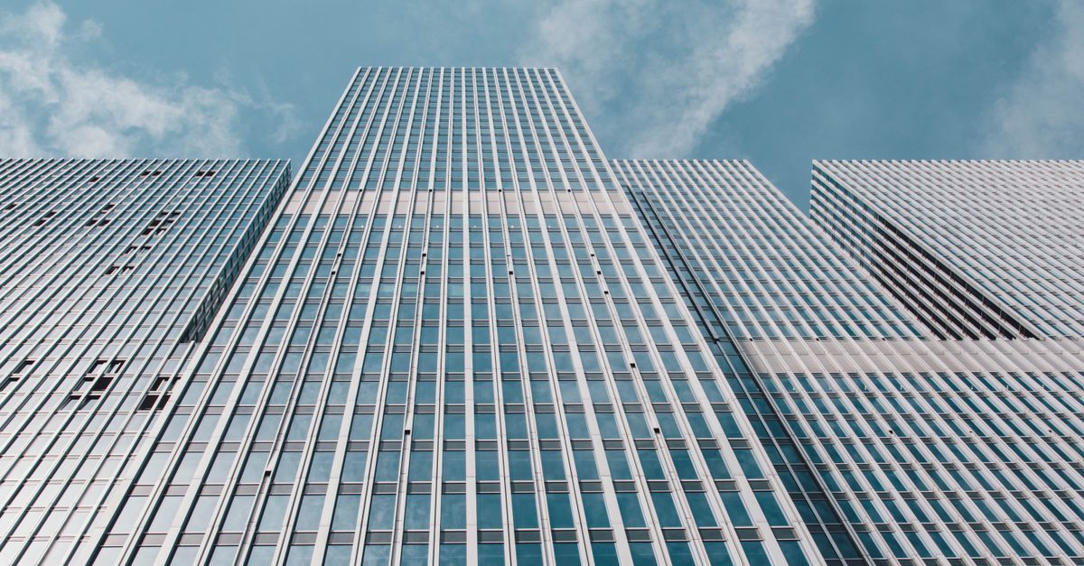 Low angle view of contemporary skyscrapers against a clear sky in Almere, Netherlands.