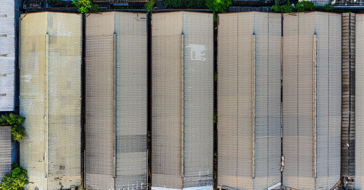 Aerial shot of large warehouses in Kecamatan Pademangan, Jakarta, showcasing industrial architecture.