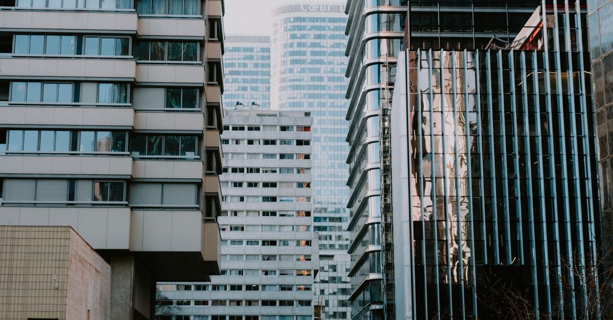 A dynamic view of modern high-rise buildings in a city showcasing urban architecture.