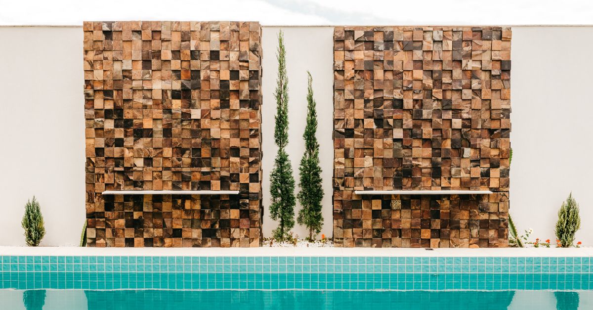 Modern design of poolside located in resort area of contemporary hotel in daytime