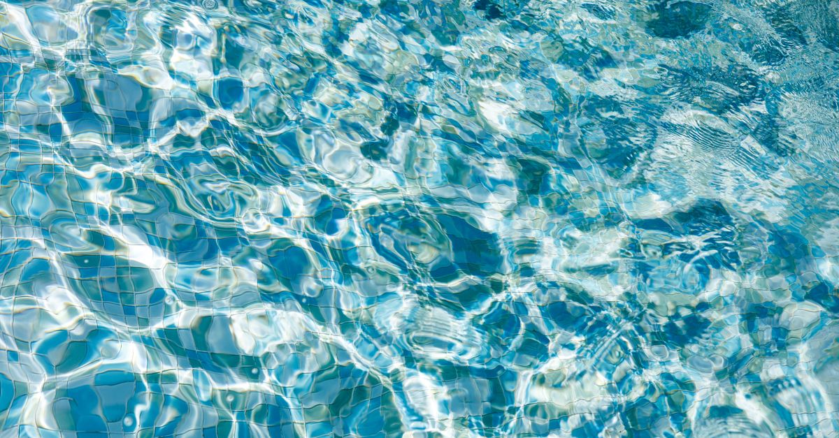 Vibrant rippling water surface with sunlight reflections creating a soothing pattern.