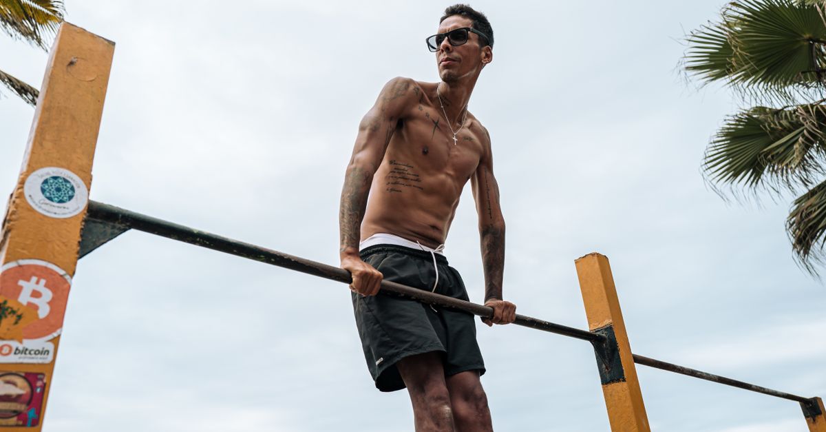 Athletic man practicing calisthenics on a sunny day in Trujillo, Peru.