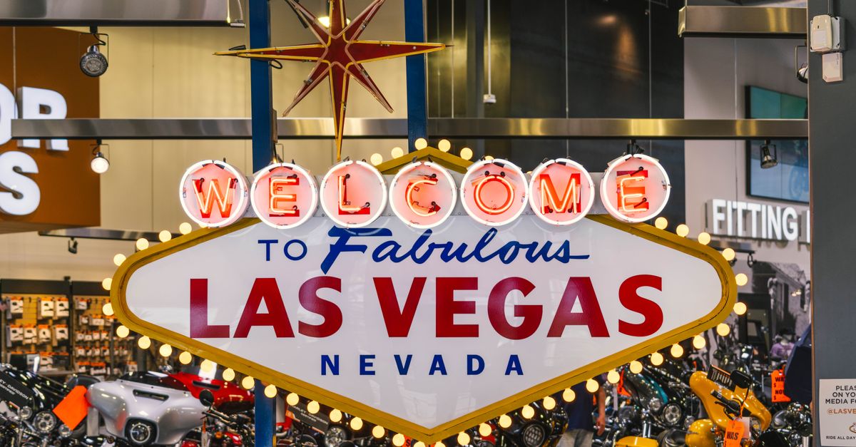 Harley Davidson store in Las Vegas featuring the famous Welcome to Las Vegas sign indoors, surrounded by motorcycles.