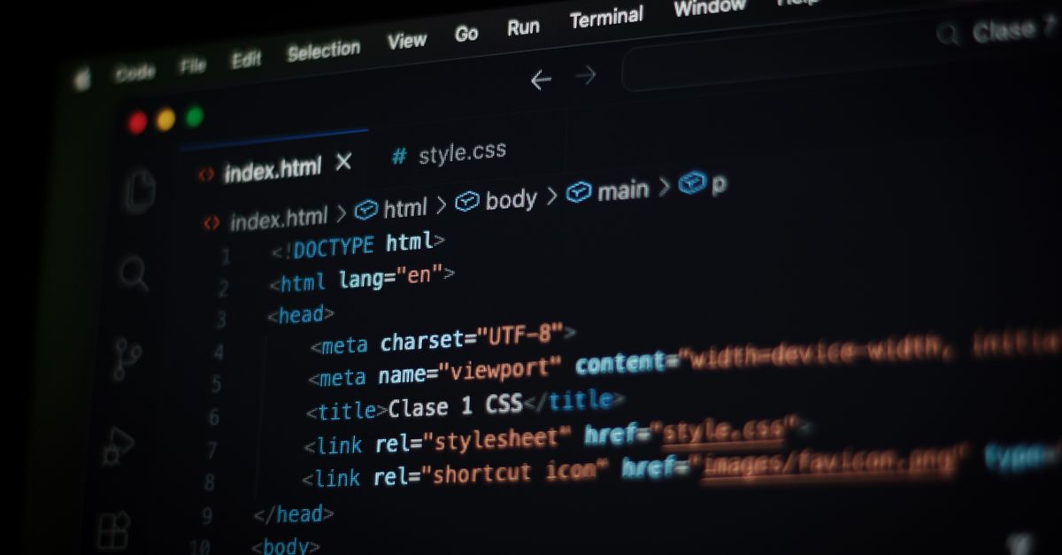 Close-up of HTML code displayed on a computer screen in dark mode, focusing on programming concepts.