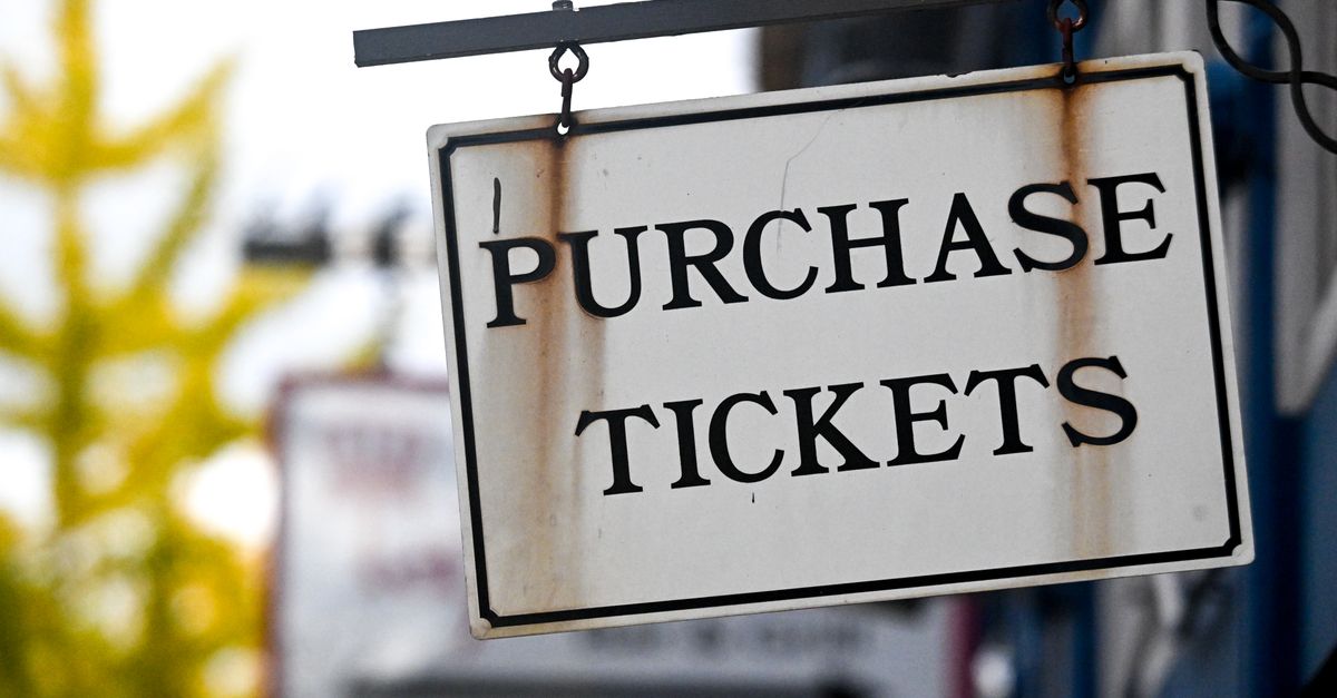 Close-up of a vintage 'Purchase Tickets' sign in Covington, Kentucky.