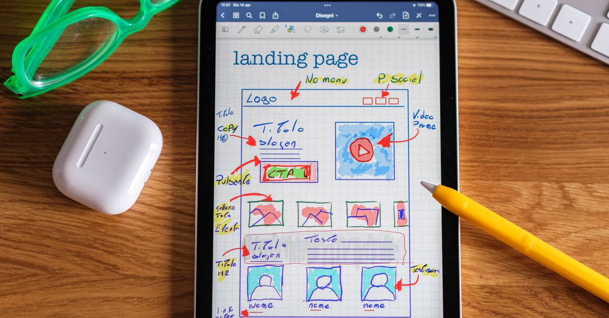 Close-up of tablet showing a hand-drawn landing page design, ideal for web development concepts.