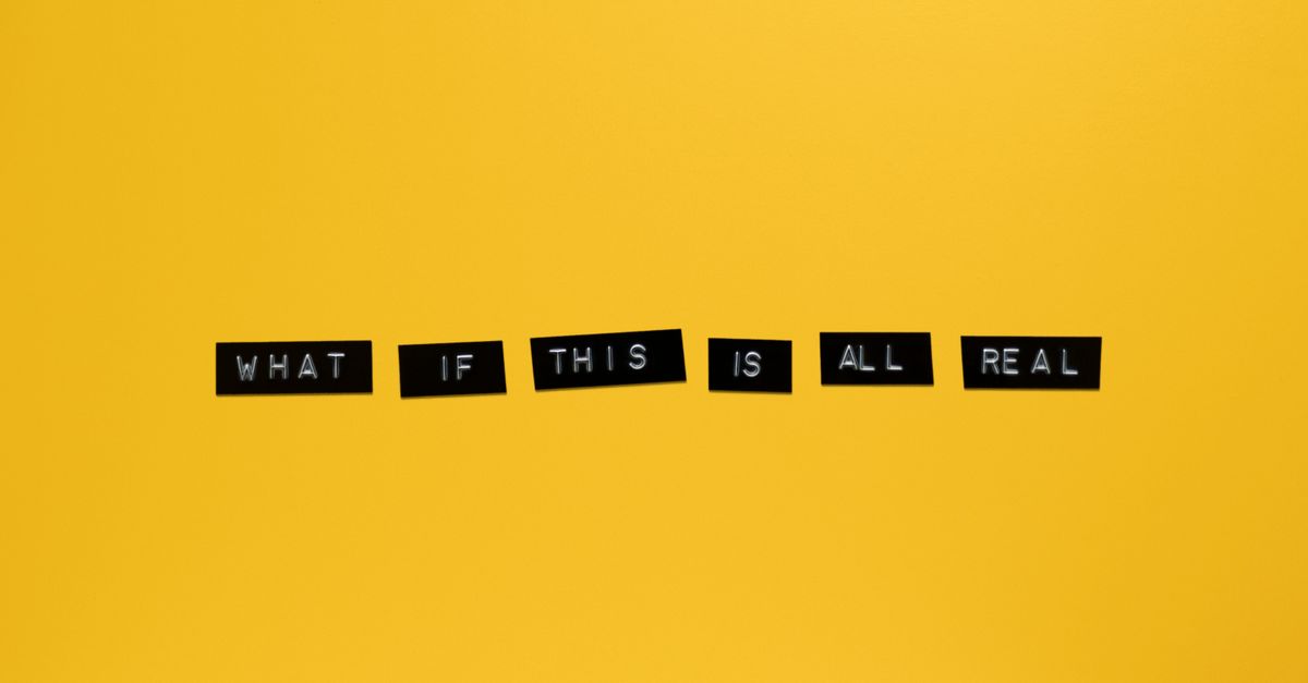 Minimalist text on vibrant yellow backdrop reading 'What if this is all real.'