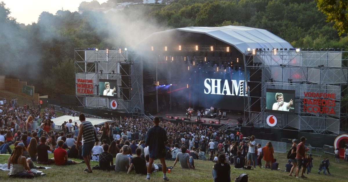 A lively outdoor concert at a music festival in Paredes de Coura, Portugal.