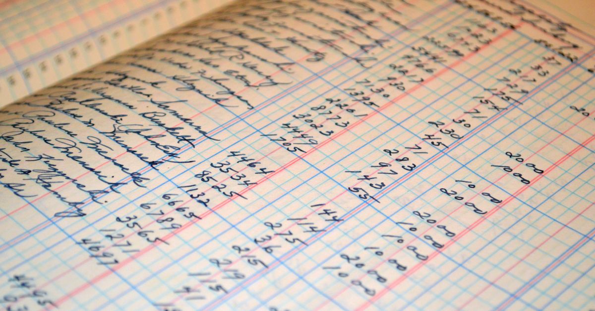 Close-up of a vintage handwritten ledger detailing financial records and accounts.